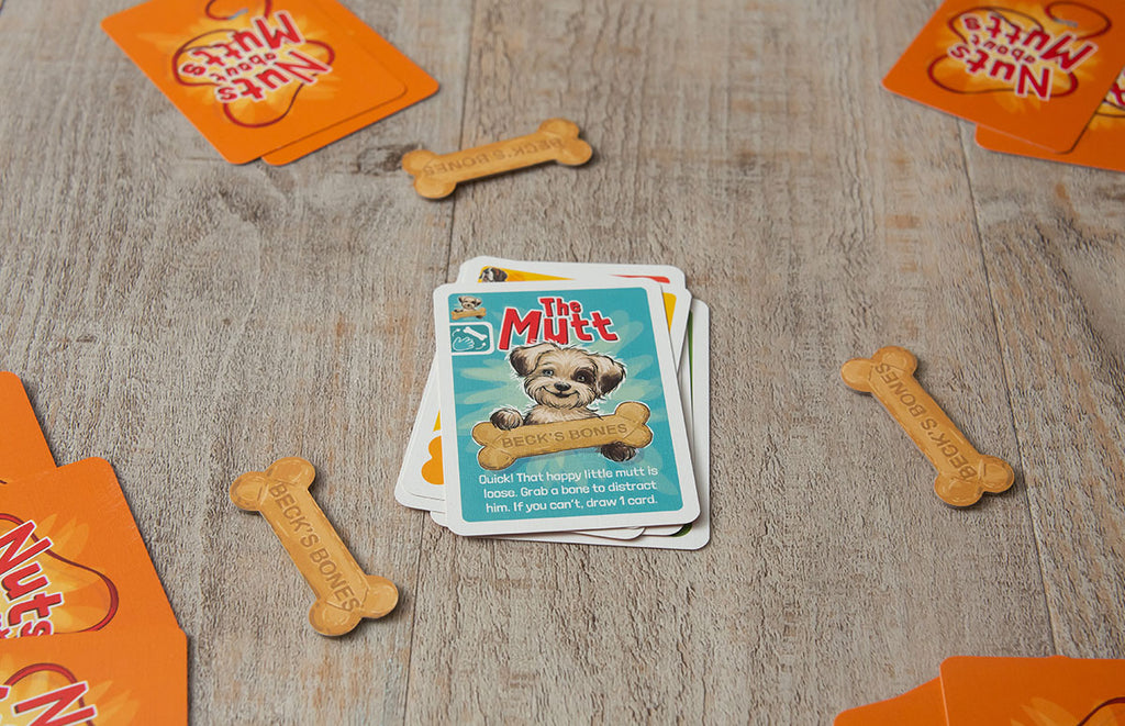 Portrait Photo with Contents of Board Game Representing Nuts about Mutts at Grandpa Beck's Games